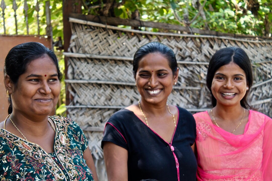 Friendly team of community coordinators standing together and smiling