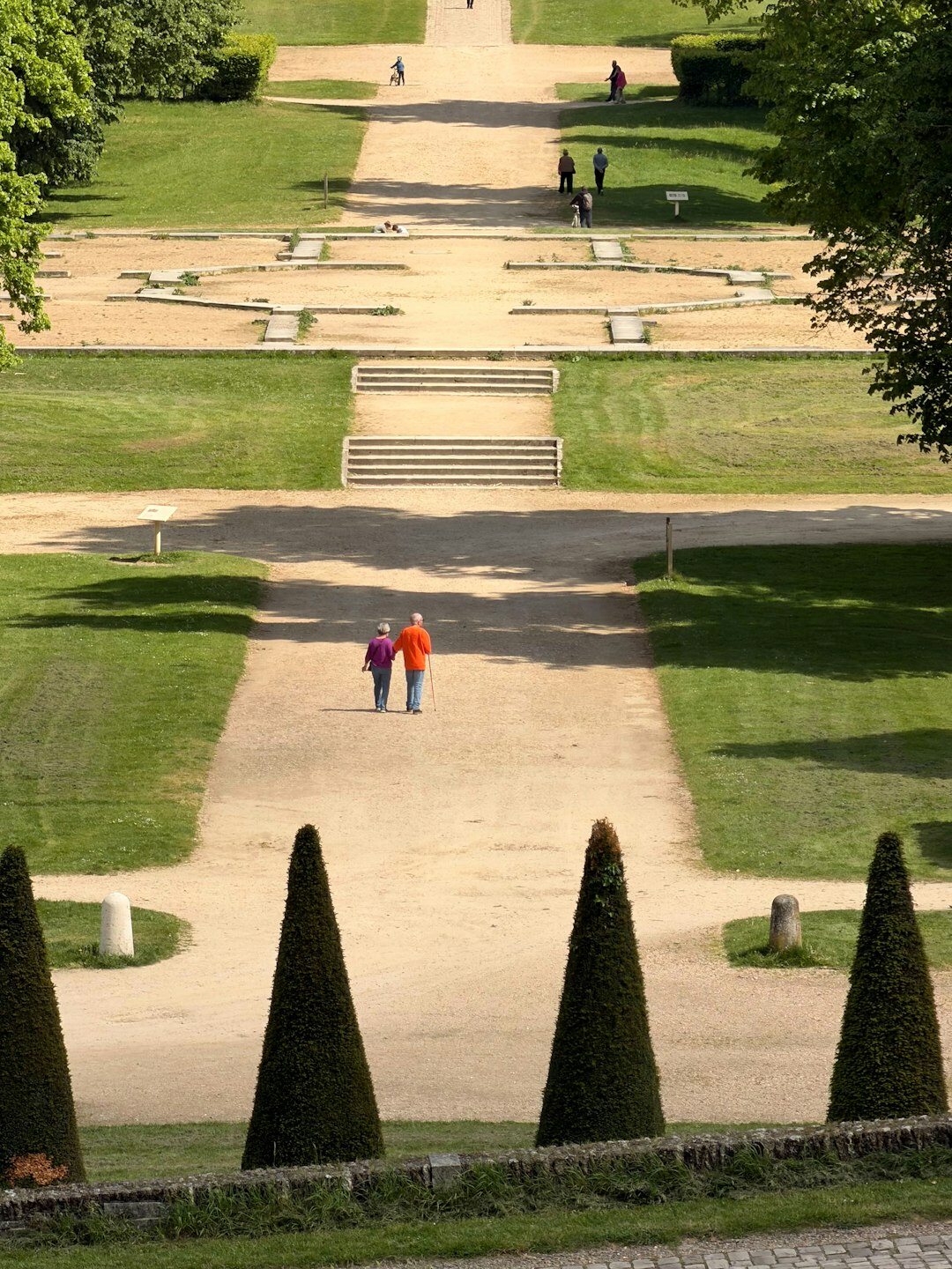 senior couple walking in garden