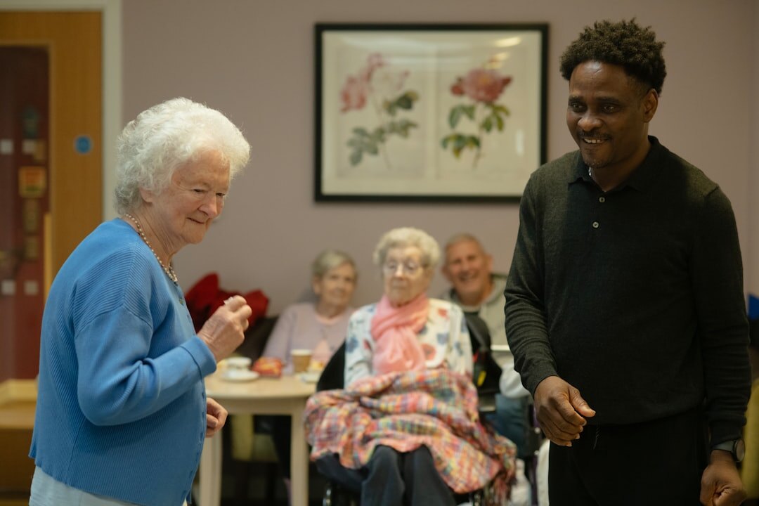 Young volunteer helping an elderly person with a warm smile